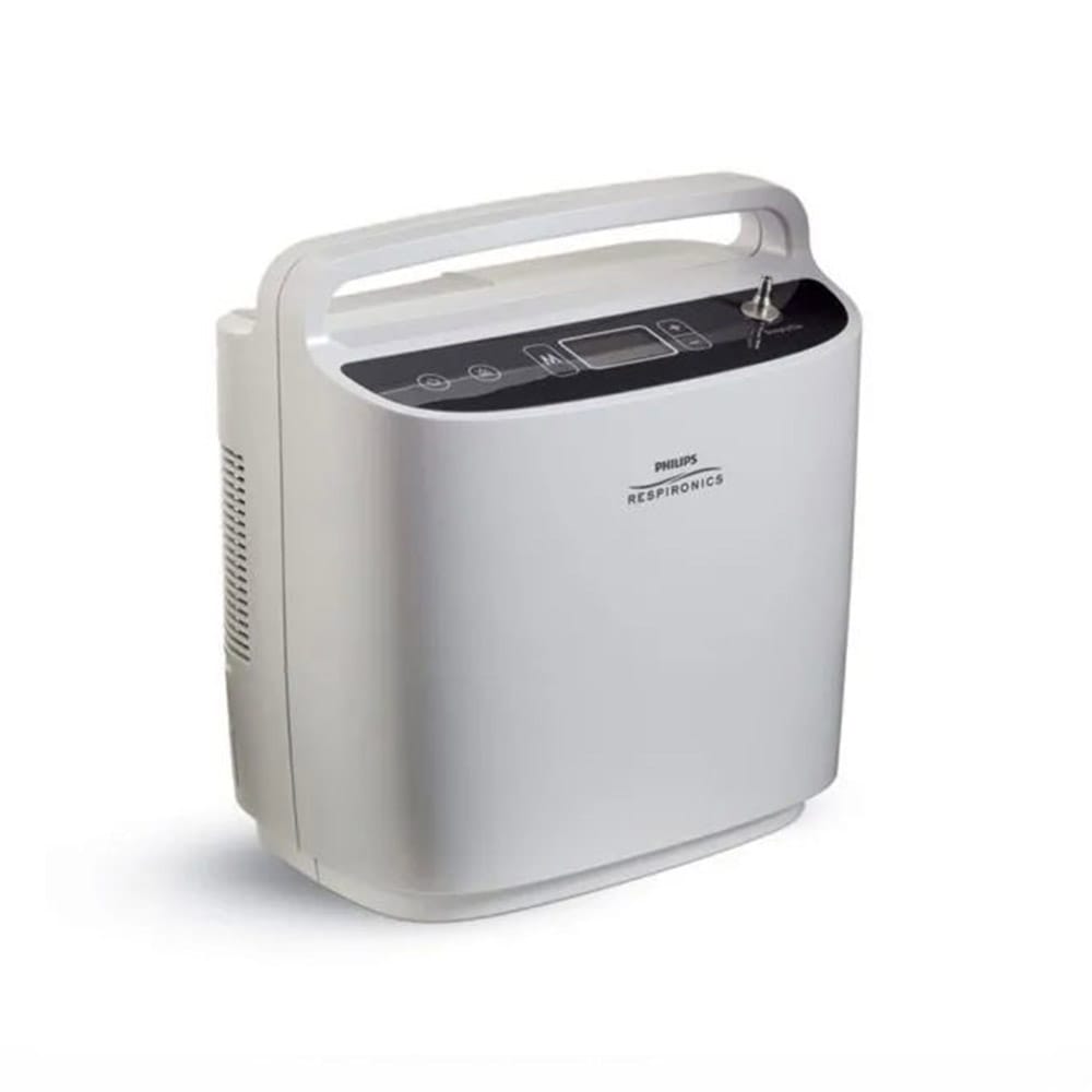 A photo of SimplyGo Portable Oxygen concentrator with carry case and accessories, set up for home or travel use.